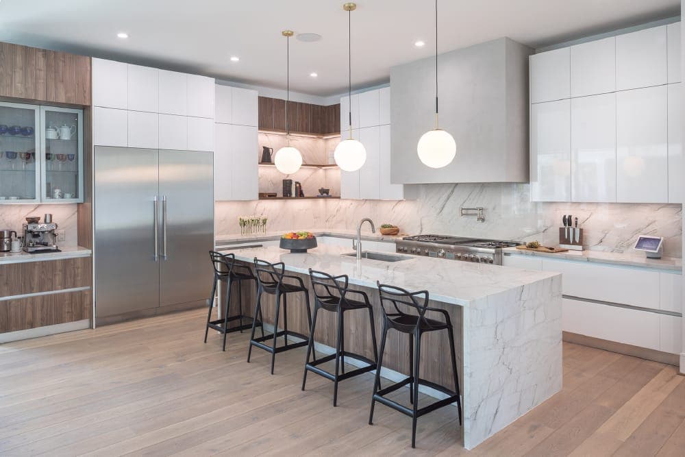 Kitchen counter with white cabinets, tile backsplash and finished trim details
